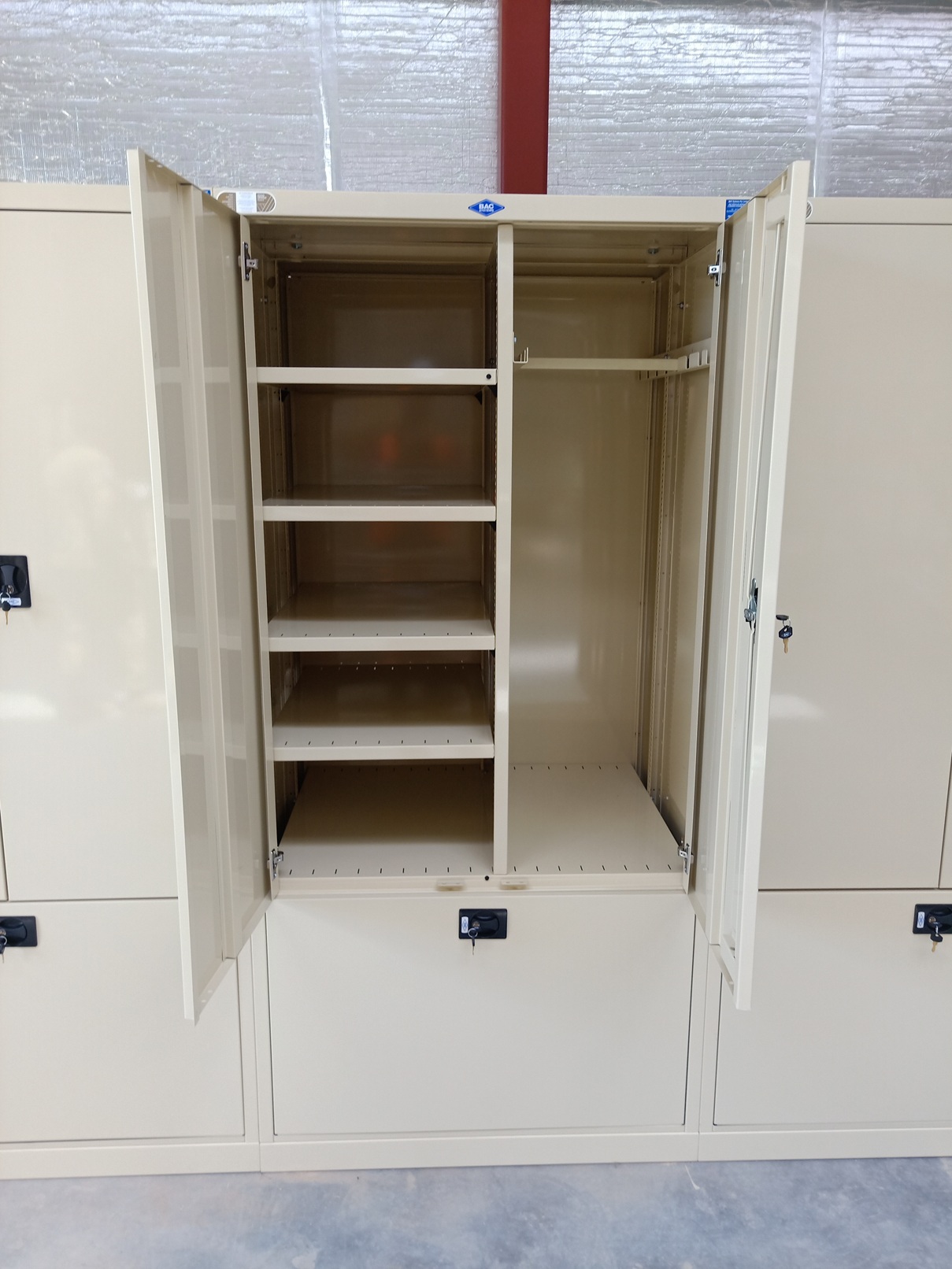 BAC Integrated Soldier Equipment Locker (ISEL) - Narrow Type (BAC A2100-ISEL) - showing lower DP1 Trunk storage location with independent fold-away door, and upper personal item storage locations with lockable double doors.