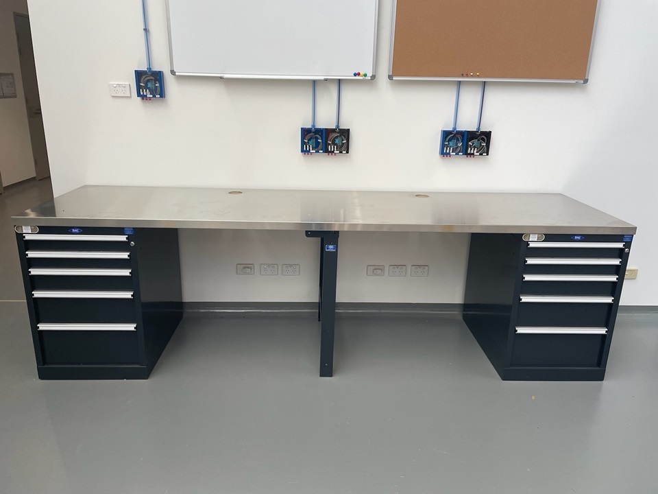 A purpose-built workbench with modular storage configured to suit and a dedicated copper benchtop for specific usage.